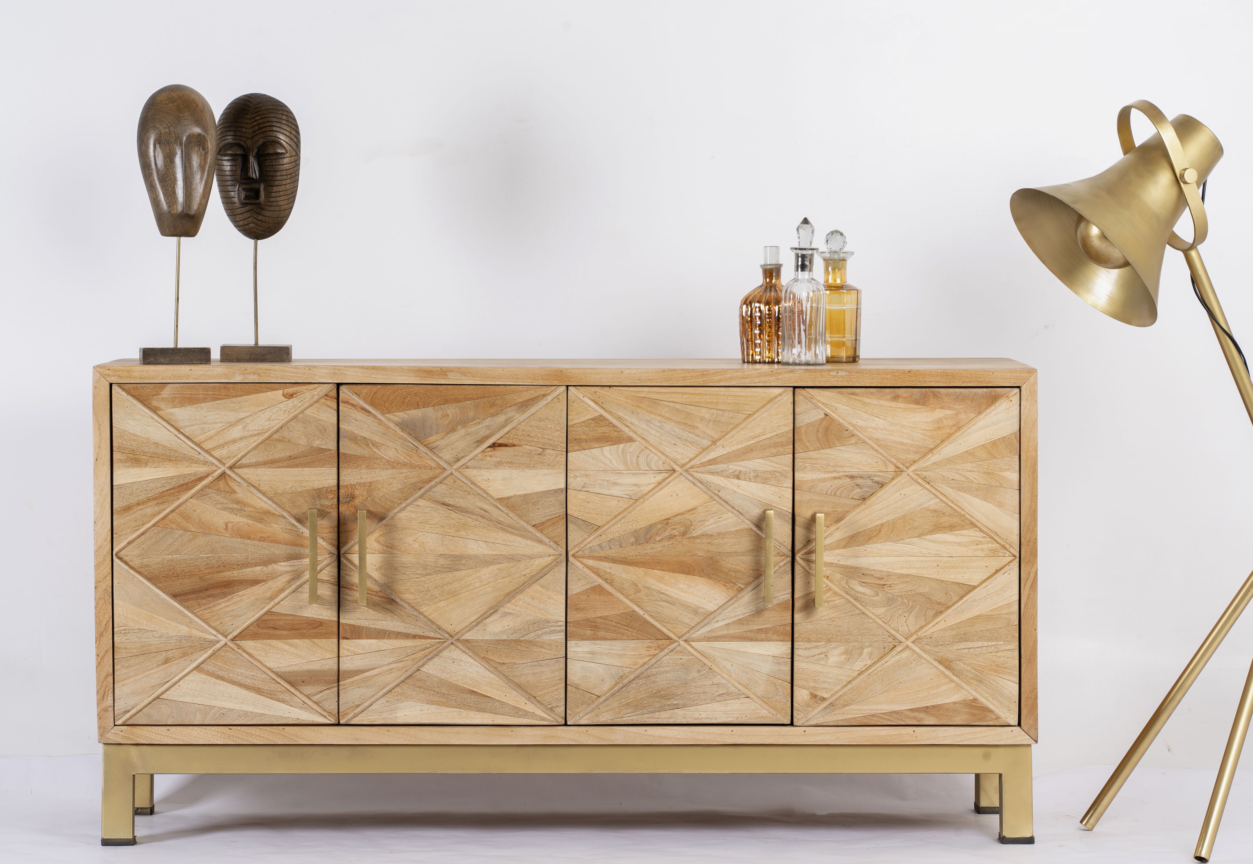 Handcrafted mango wood sideboard with star-carved doors and brass-plated iron stand—an artisanal furniture piece blending minimalistic and rustic design elements.