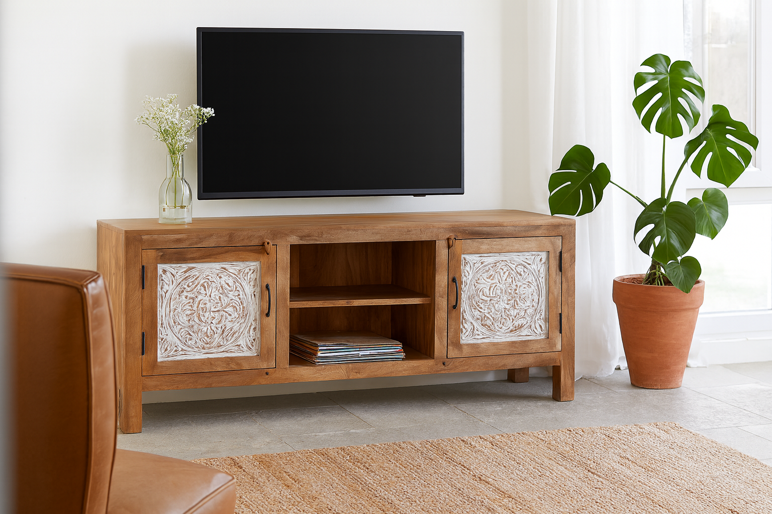 Lifestyle imagination of a wood carved sideboard Alka, Indian furniture made from mango wood with floral carvings, whitewashed finish, 150 × 40 × 60 cm.