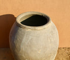 Close up image of an antique-style Indian clay vase with wide body – a Bali style clay vase perfect for Indian home decoration and boho-inspired interiors.