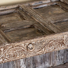 Close up image of an antique console table wood counter with open shelves, a one-of-a-kind teak piece of unique furniture.