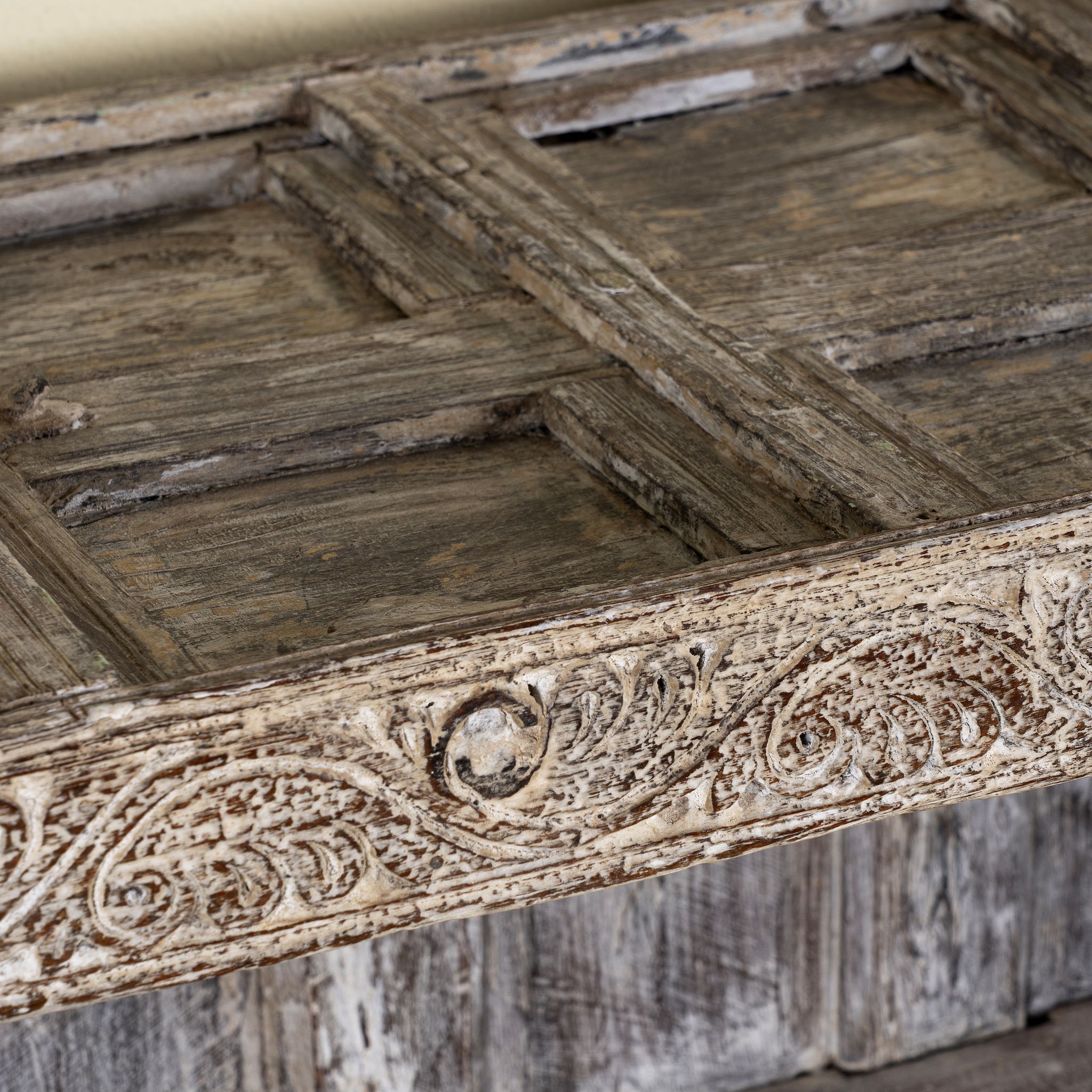 Close up image of an antique console table wood counter with open shelves, a one-of-a-kind teak piece of unique furniture.