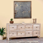 Side angle image of a reclaimed sandblasted wooden chest of drawers with 8 drawers, part of our Ibiza style furniture collection.