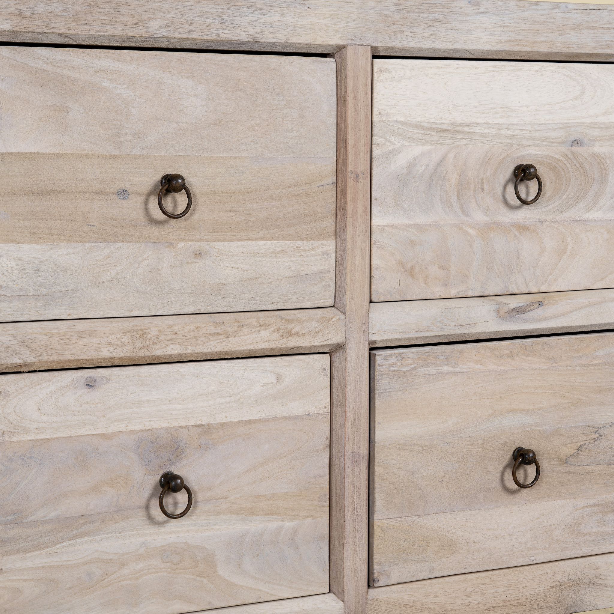 Close up image of a eclaimed sandblasted wooden chest of drawers with 8 drawers, part of our Ibiza style furniture collection.
