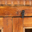 Close up image of a reclaimed teak wood display cabinet with four glass-panelled doors – wooden showcase cabinet crafted as sustainable furniture with timeless appeal.