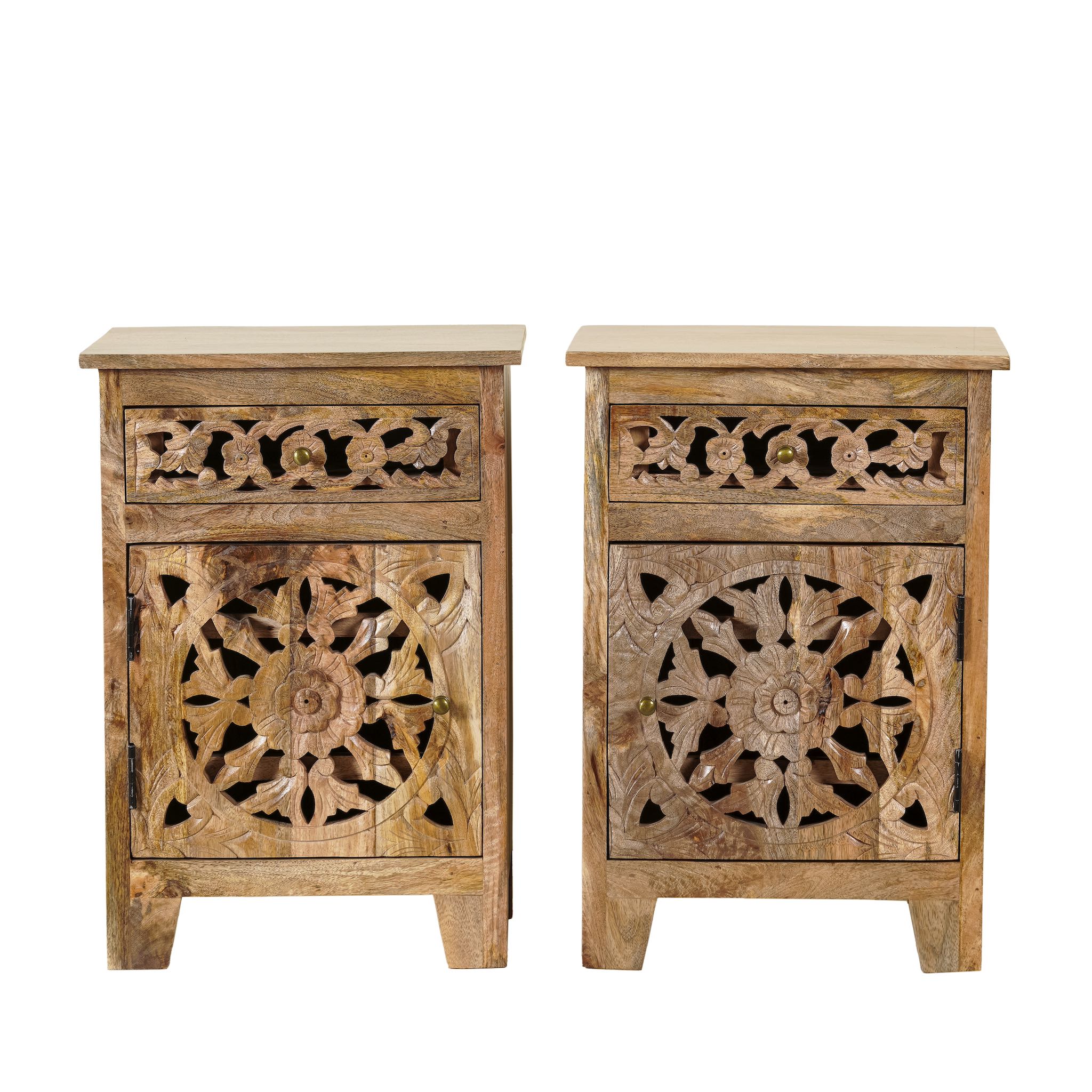 White background image of a pair of hand-carved bedside tables made of mango wood, featuring intricate round floral hand carvings on the doors. 