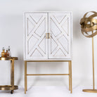 Tall whitewashed mango wood cabinet with carved lines and antique brass iron base, 91 × 154 × 43 cm.