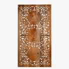 White background image of a hand-carved mango wood wall panel with floral engravings in natural finish – Arusha model by Om Home & Garden