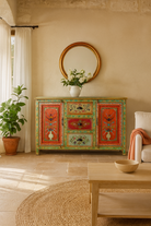 Lifestyle imagination of a sustainable hand painted sideboard made from reclaimed teak wood with floral motifs; bold bohemian furniture, 150 × 45 × 90 cm.