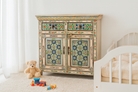 Lifestyle imagination of a hand painted cabinet made from reclaimed wood with colourful traditional Indian motifs, 90 × 90 × 40 cm.