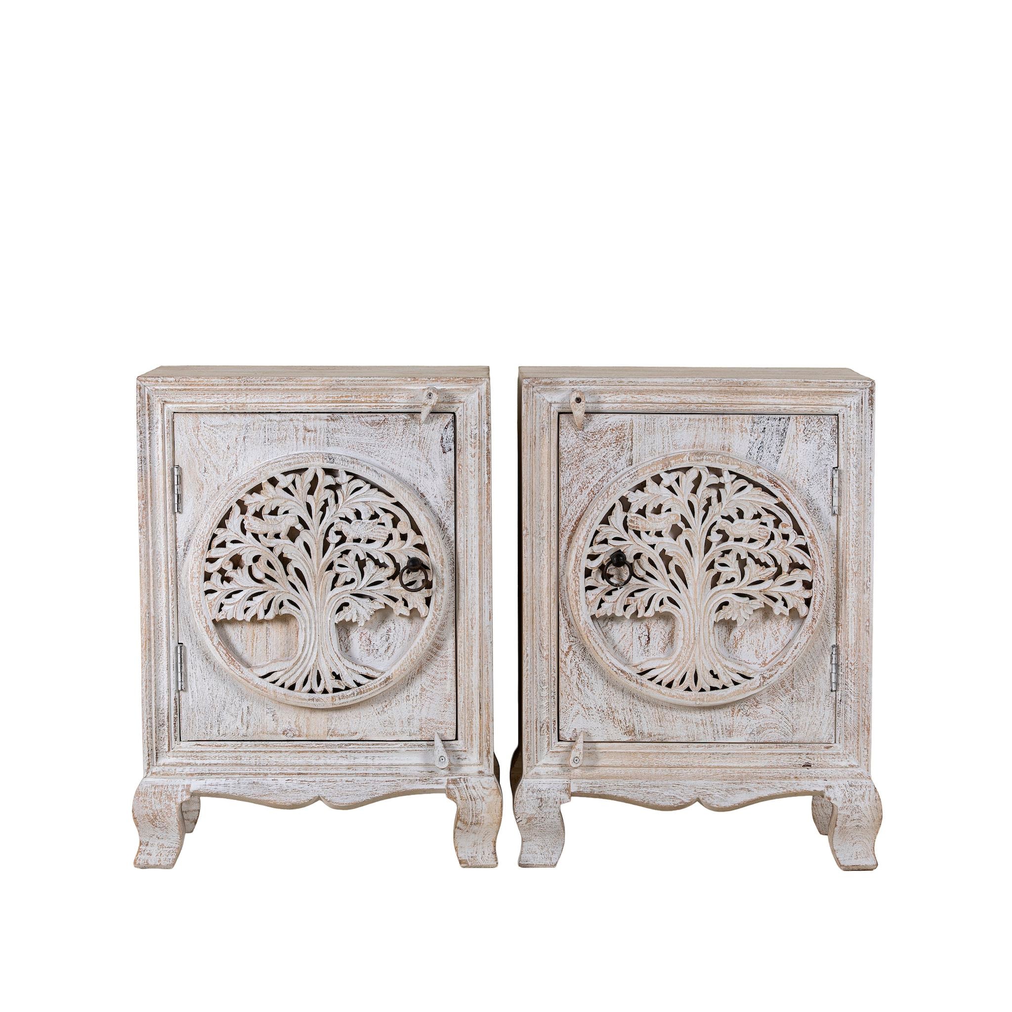 Pair of white wooden cabinets with tree carvings on a white background