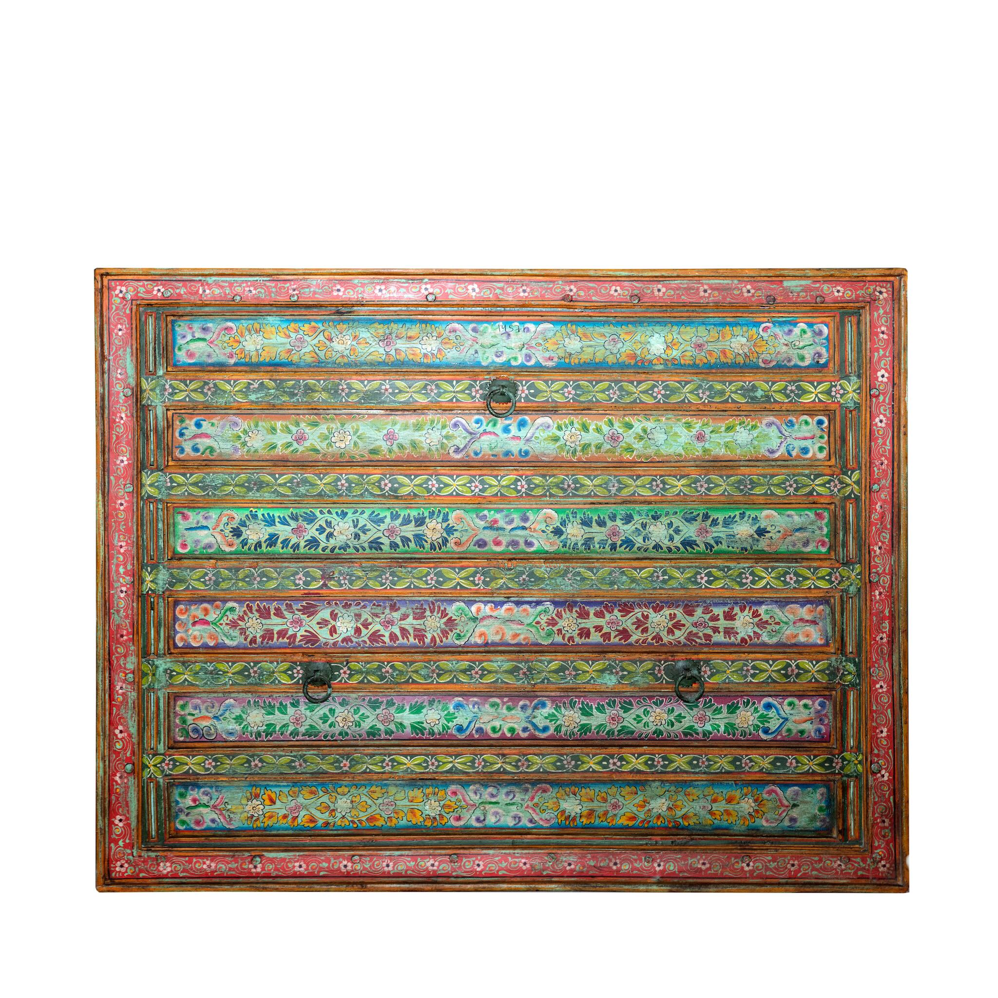 White background image of a Cauvery hand painted head board made from an antique Indian teak door, featuring traditional floral motifs in blue and cream and original iron hardware—an elegant example of hand painted head boards and authentic Indian headboards.