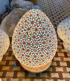 Lighted sample for a mosaic pendant lamp Bhuv with round ceiling panel and 7 hanging mosaic stone lights – handcrafted lighting design, 60 cm panel with 30x20 cm teardrop light bodies.