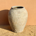 Antique Indian clay vase with weathered surface – a Bali style clay vase ideal for Indian home decoration and rustic bohemian interiors.