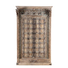 Decorative wooden cabinet with intricate carvings on a white background