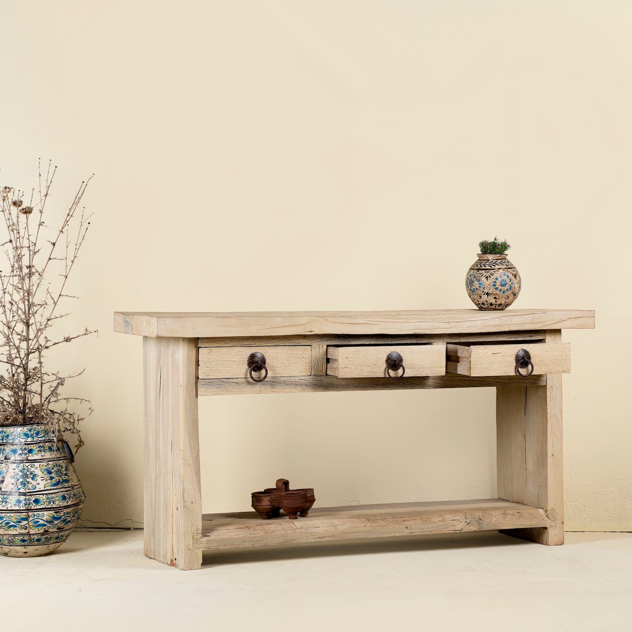 Open drawer image of a Ibiza style reclaimed teak console table with sandblasted finish, three drawers, and lower shelf, versatile as bathroom furniture or hallway console.