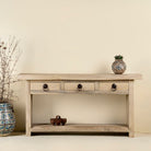Ibiza style reclaimed teak console table with sandblasted finish, three drawers, and lower shelf, versatile as bathroom furniture or hallway console.