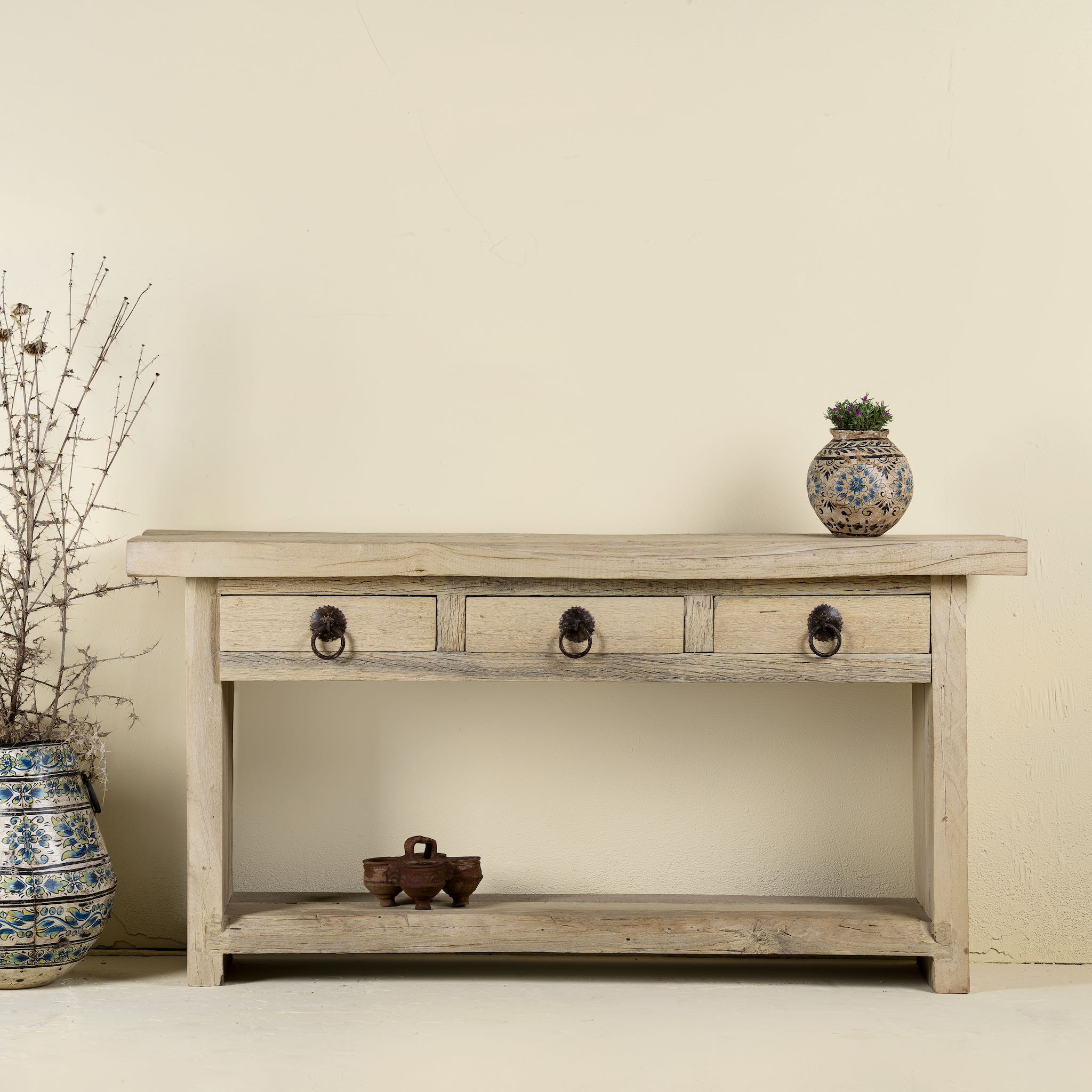 Ibiza style reclaimed teak console table with sandblasted finish, three drawers, and lower shelf, versatile as bathroom furniture or hallway console.