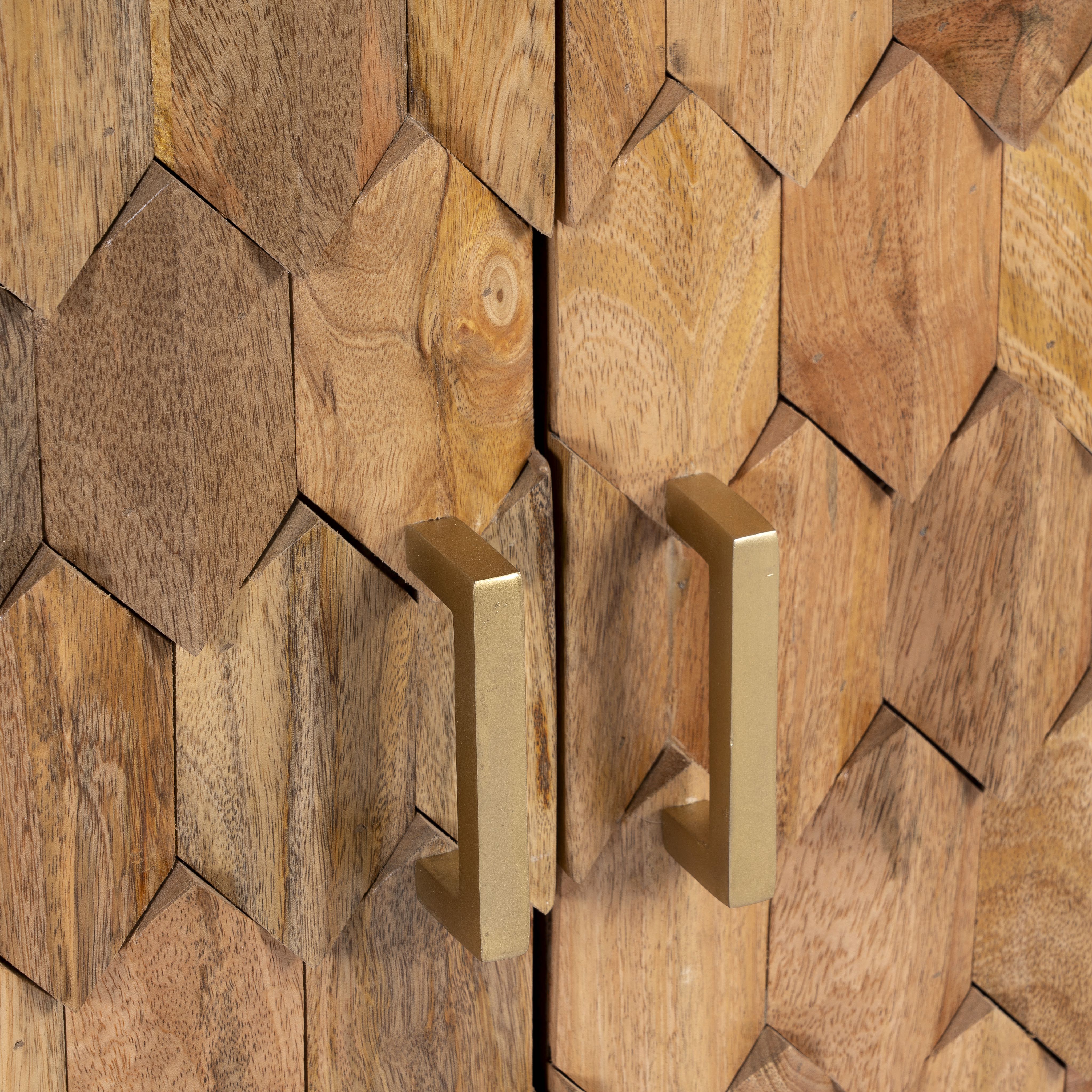 Close up image of a handcrafted mango wood sideboard with hexagonal inlay design and brass-finished legs—artisanal bedroom furniture combining craftsmanship and modern elegance.