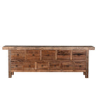 White background image of a large wabi-sabi style console table crafted from reclaimed wood, featuring a natural weathered finish and multiple drawers with simple metal ring pulls, embracing rustic imperfection and minimalist charm.
