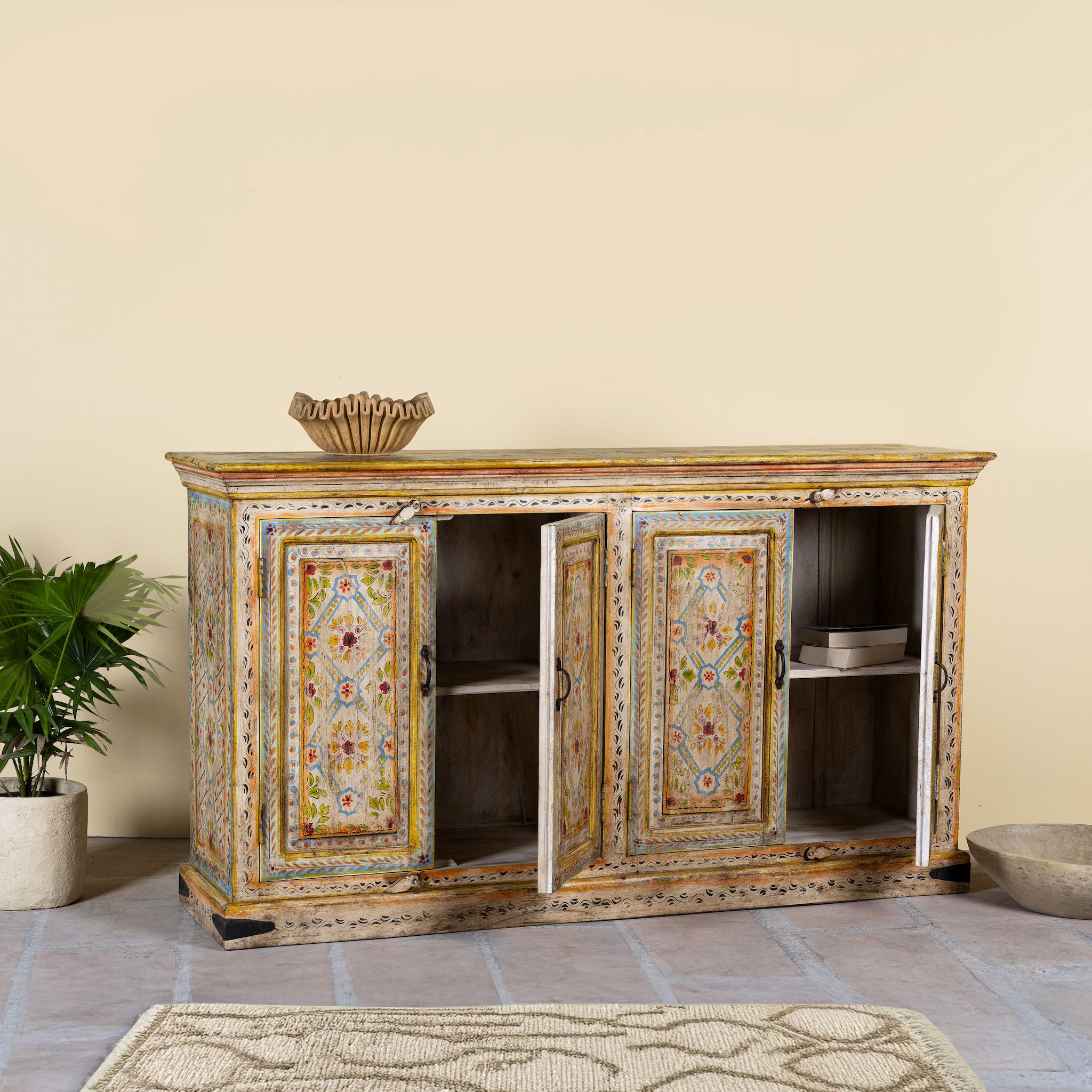 Ope door image of a hand-painted reclaimed wood sideboard with floral motifs, a bold piece of vintage furniture for living room furniture collections.