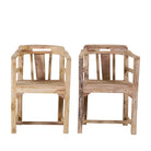 Front view image of a rustic-style armchair made from reclaimed teak wood, featuring a natural, unfinished look with visible wood grain and variations in tone, and a curved backrest with vertical slats.
