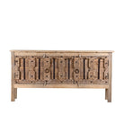White background picture of a console table made from old teak door panels, featuring traditional hand-carved details, iron ring accents, and built-in storage in a natural rustic finish.
