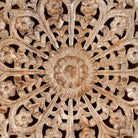 Close up image of a hand-carved whitewashed mango wood wall panel with floral design – Kataee model by Om Home & Garden