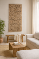 Lifestyle scene with a hand-carved whitewashed mango wood wall panel with floral design – Kataee model by Om Home & Garden