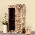 Side angle image showing pen door of a and-carved reclaimed wood wardrobe with vintage finish – a sustainable furniture piece ideal for Indian home decor and rustic interiors.