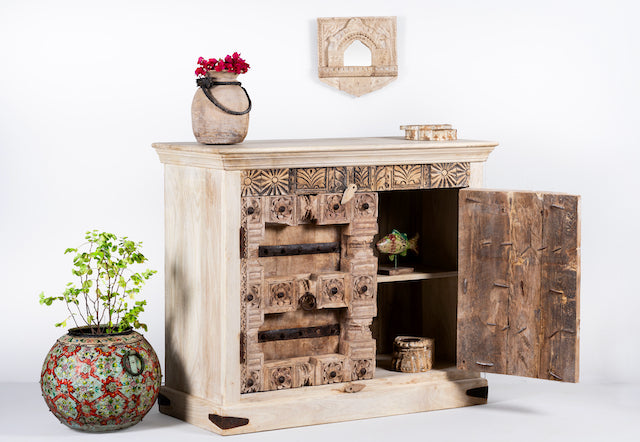 Side angle image with open door of a whitewashed reclaimed teak sideboard in Ibiza style, featuring sandblasted old wood surfaces and rustic design; 112 × 90 × 50 cm.