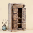 Vintage-style wooden cabinet with open doors on a beige background