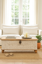 Lifestyle image of a hand-carved mango wood vintage chest with whitewashed finish and iron fittings – elegant storage for bohemian or rustic interiors.