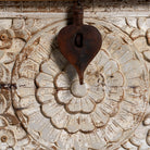 Close up image of a Indian storage box with hand carved floral design.