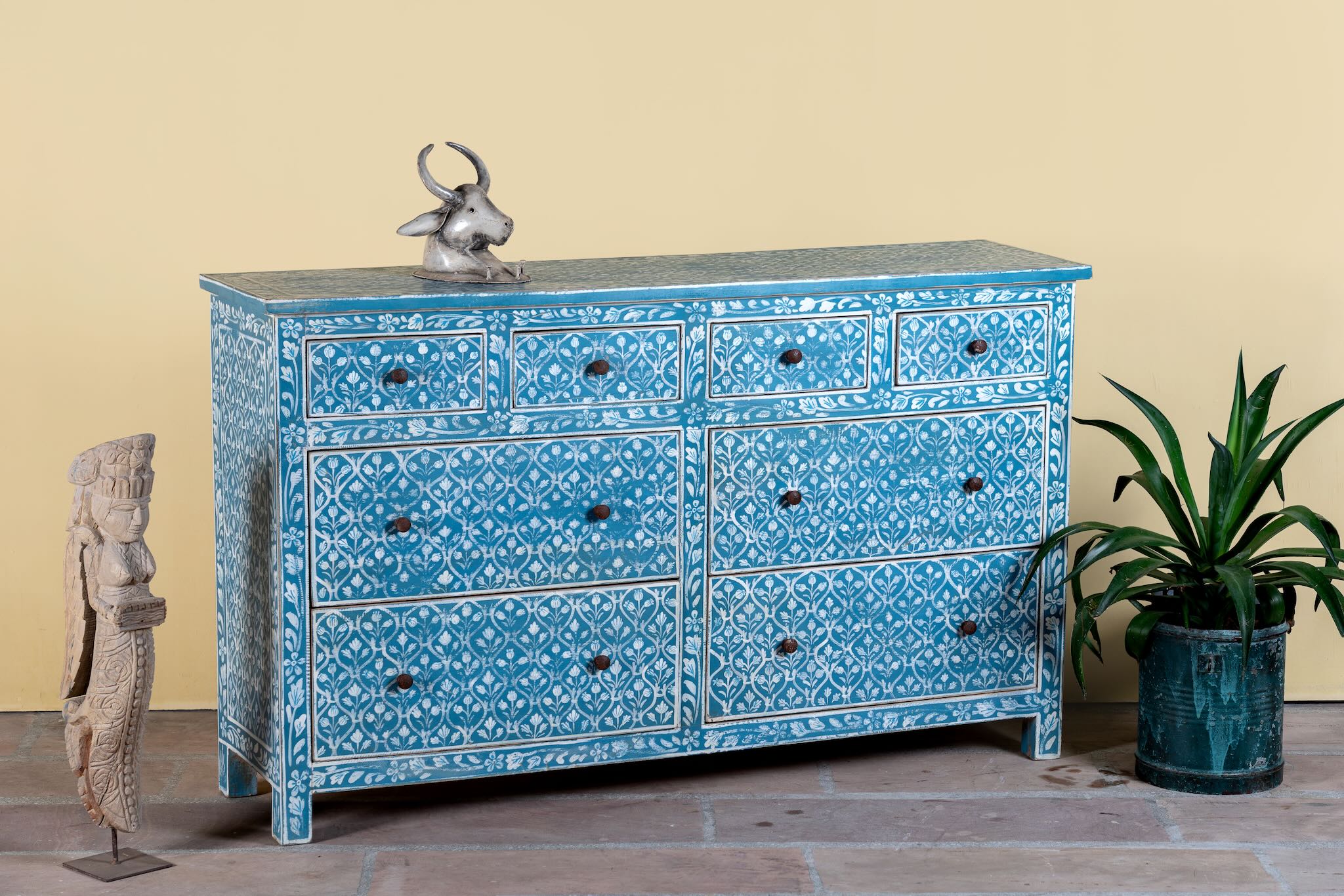 Side angle image of a hand-painted chest of drawers made of reclaimed wood in blue and white – Nitara model by Om Home & Garden