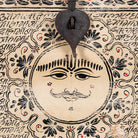 Close up image of a hand-painted reclaimed wood chest box with Indian motifs – vintage home decor and versatile storage with coffee table function.