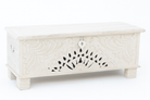 White background image of a hand-carved mango wood vintage chest with floral detailing – a one-of-a-kind mango wood chest ideal for Mediterranean-inspired interiors.