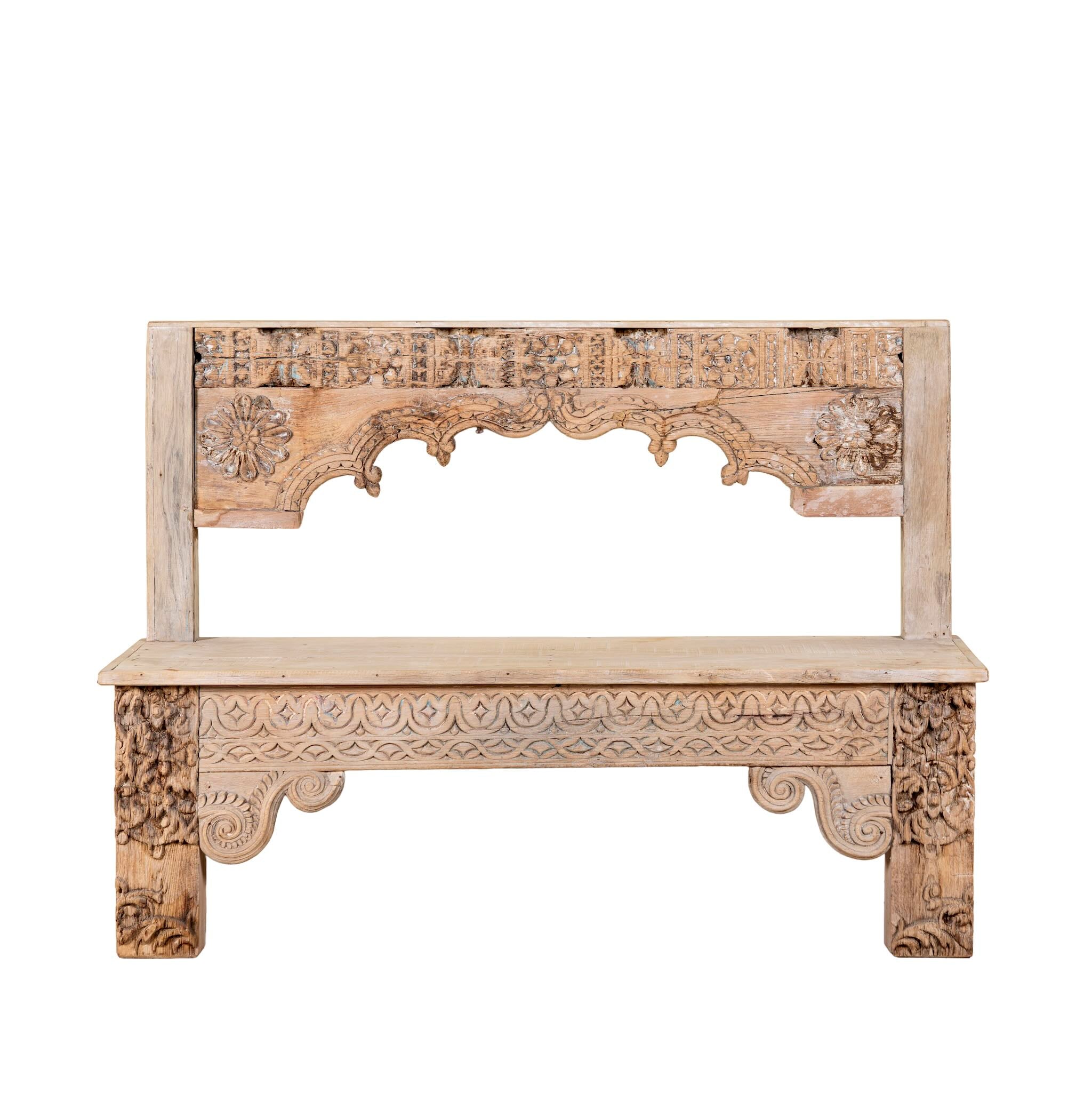 White background image of a Shraddha bench made from bleached reclaimed teak wood with intricate hand-carved floral details, showcasing traditional Indian craftsmanship and sustainable furniture design.