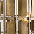 Close up image of a large round brass-plated iron pendant lamp with ornate tile surface – vintage lighting and iron pendant light ideal for dining rooms or living spaces.