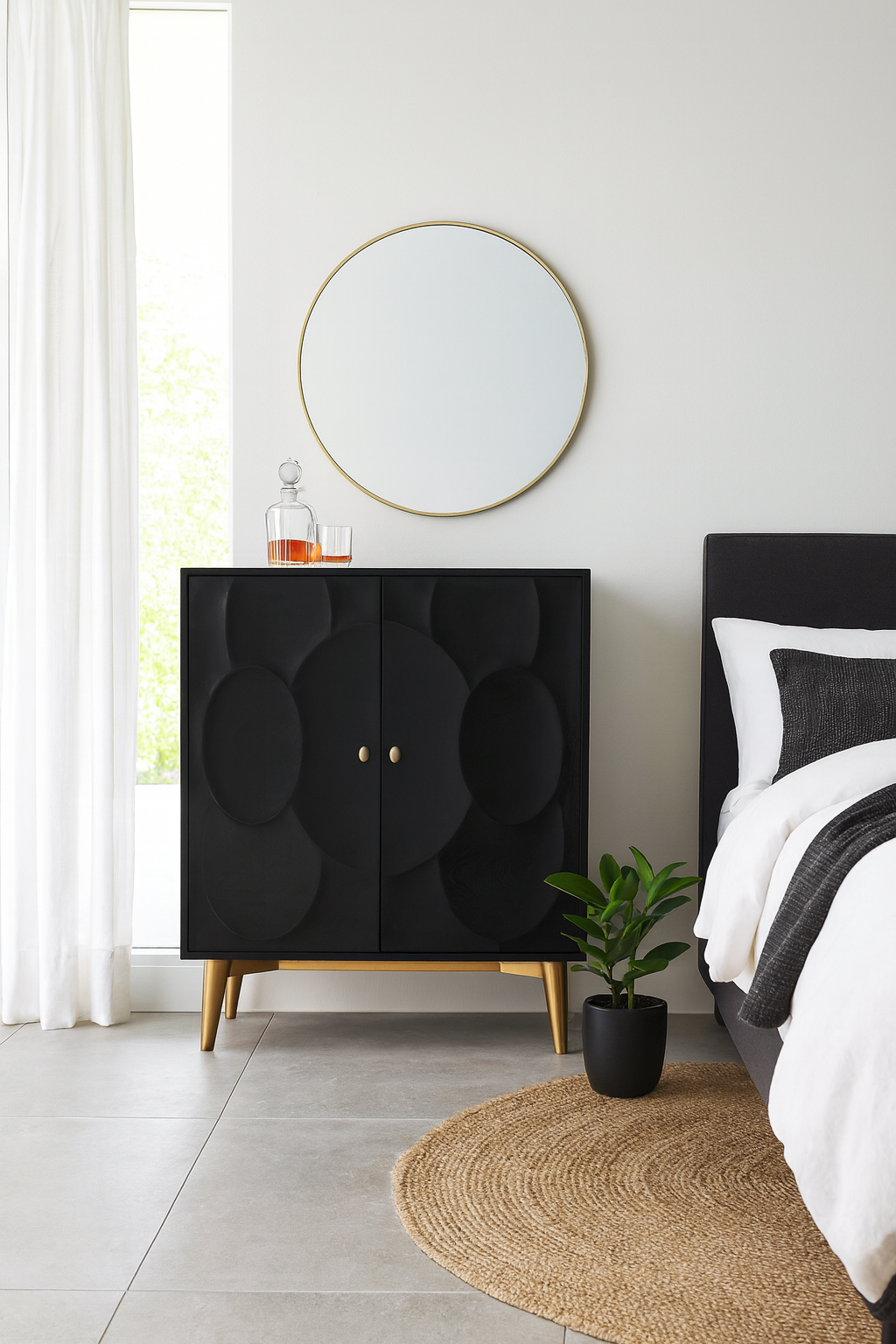 Lifestyle imagination of a black mango wood cabinet with carved circular patterns and brass-plated iron base, 91 × 43 × 111 cm.
