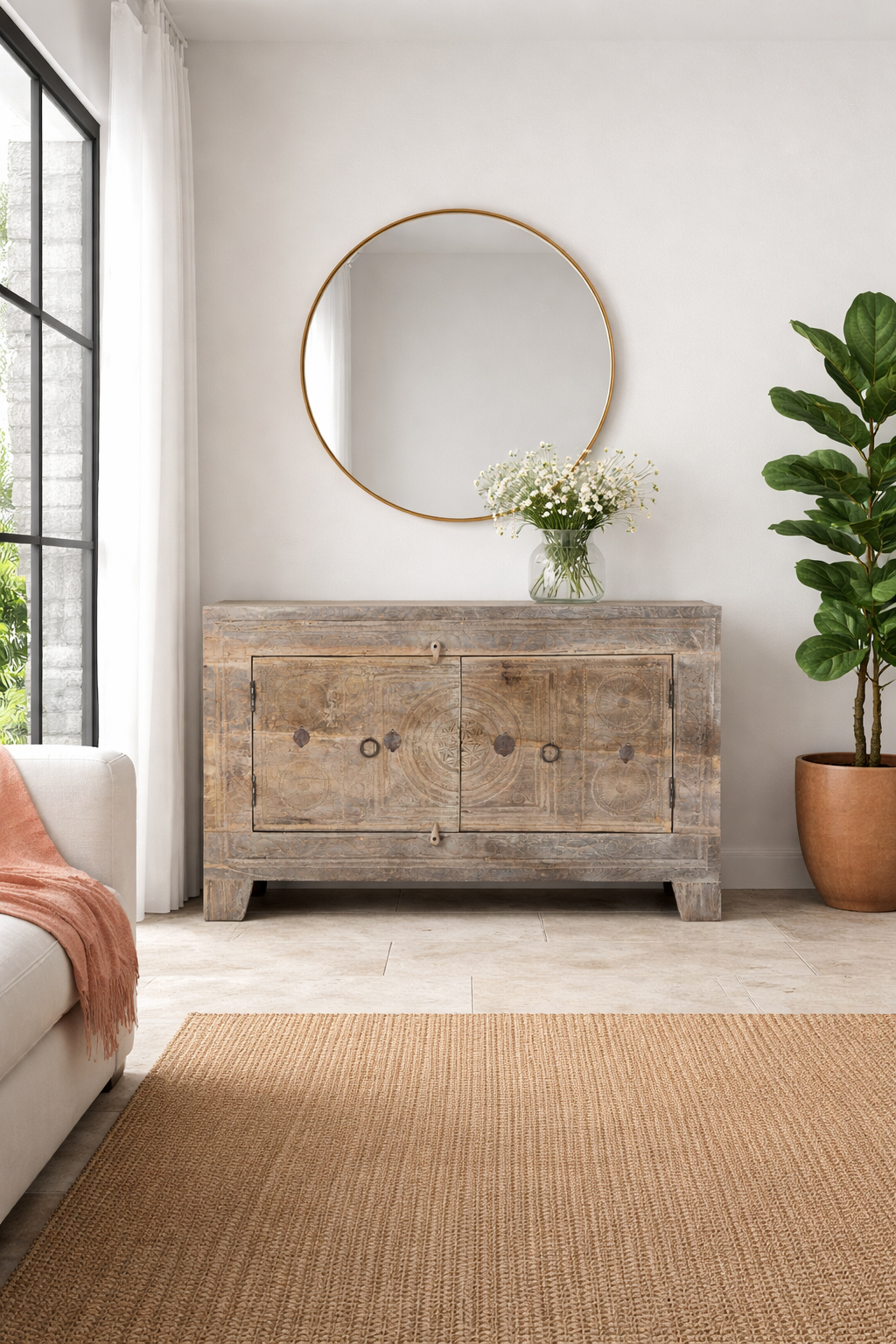 Lifestyle imagination o a handcrafted sideboard Tanay made from reclaimed teak wood, featuring antique Indian door fronts with original carvings. A Mediterranean-inspired piece of unique Indian furniture with sustainable character and functional storage.