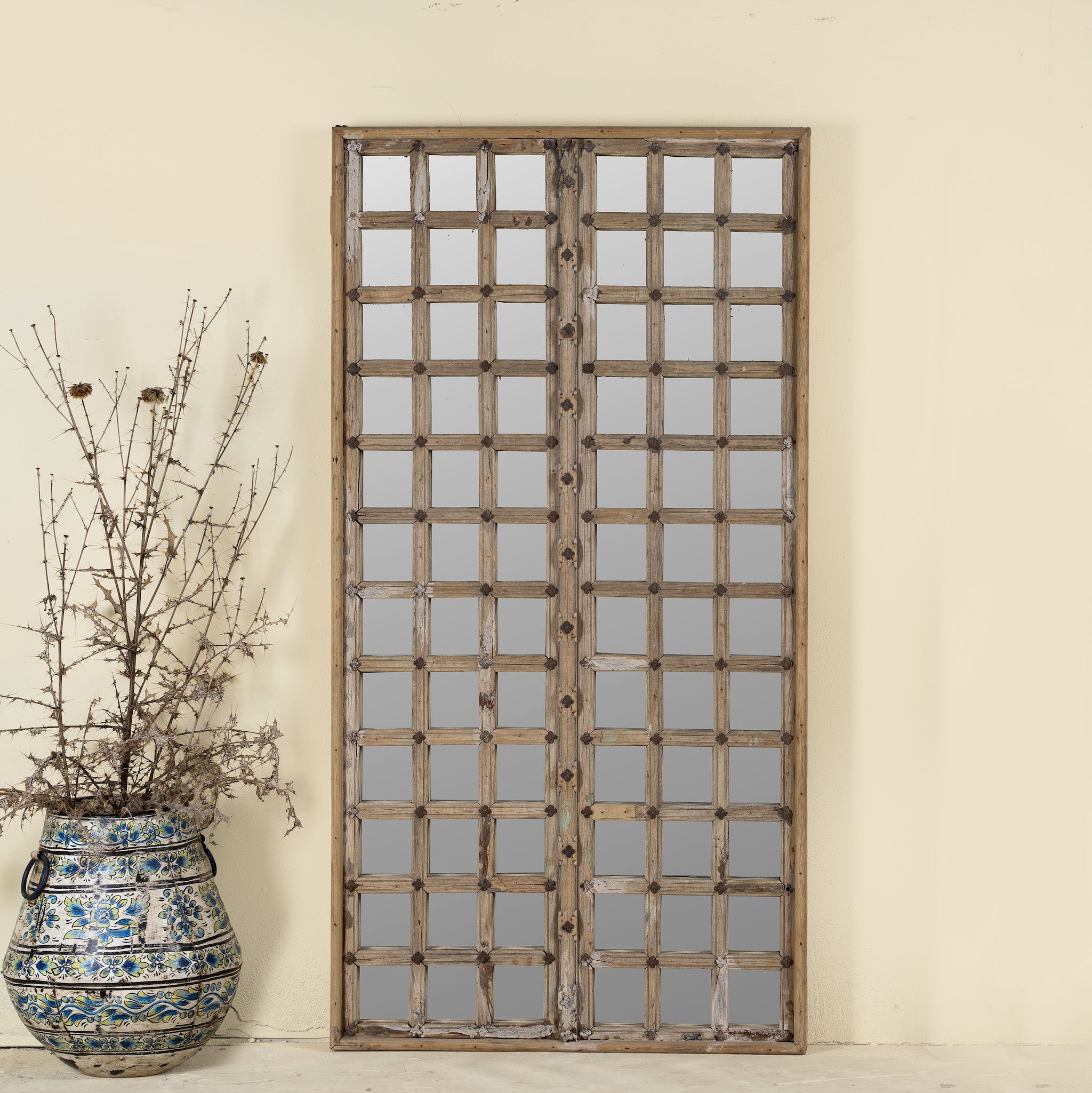 Wooden door mirror with antique teak frame and carvings, part of our Indian home decor collection.