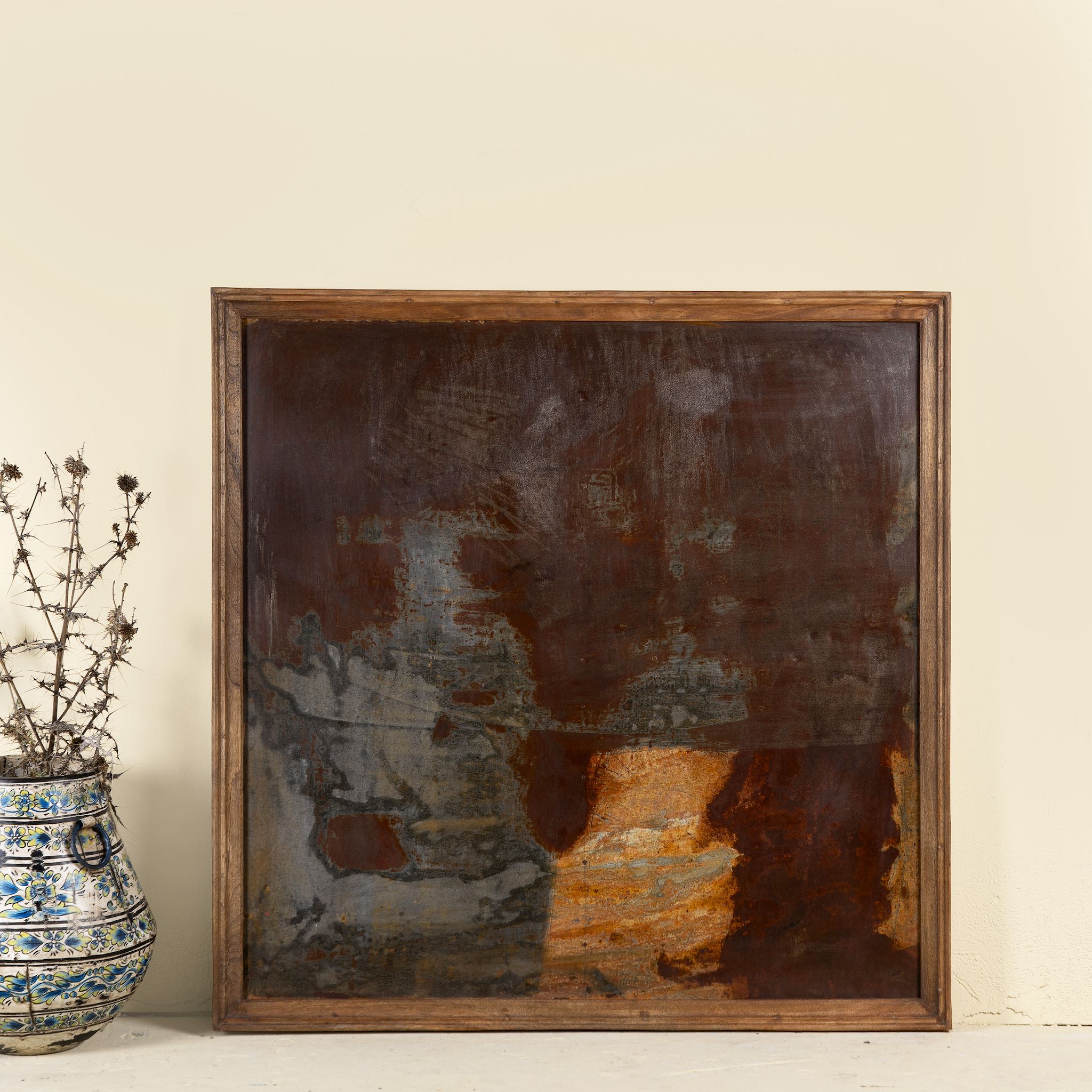 Rusted iron and teak wall panel, artisanal furniture piece, part of our Indian home decor collection.

