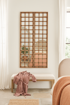 Antique teakwood mirror made from a traditional Indian door with iron details and mirror inlays – perfect as a reclaimed wood mirror for vintage home decor.