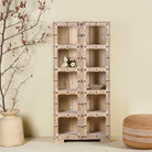 A handcrafted reclaimed teak wood shelf with iron fittings, featuring multiple compartments and placed against a neutral background with decorative items on it.