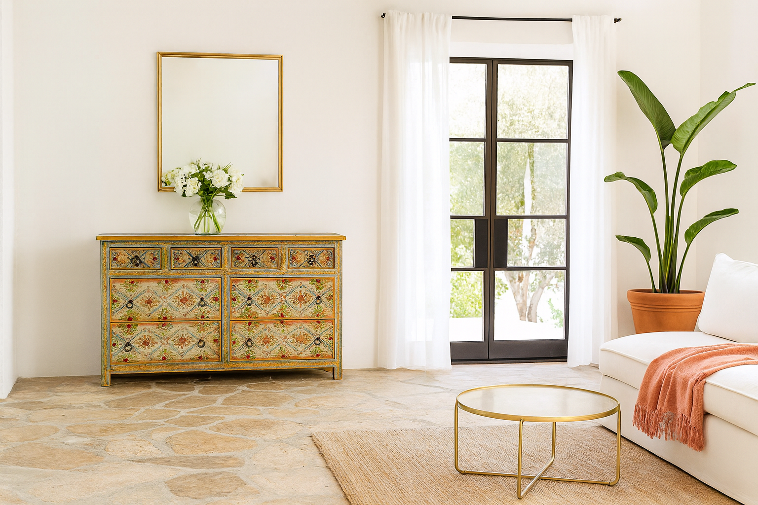 Lifestyle image of a Ziya hand‑painted chest of 8 drawers made from reclaimed wood with floral motifs and iron handles—an artisan piece of painted wooden furniture.