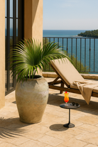 Lifestyle image of a antique clay vase with aged texture – a handcrafted Bali style clay vase ideal for Indian home decoration and earthy boho interiors.