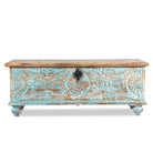 White background image of a hand-carved mango wood chest in blue with natural wood top – carved wooden furniture and wooden storage chest for eclectic or boho interiors.