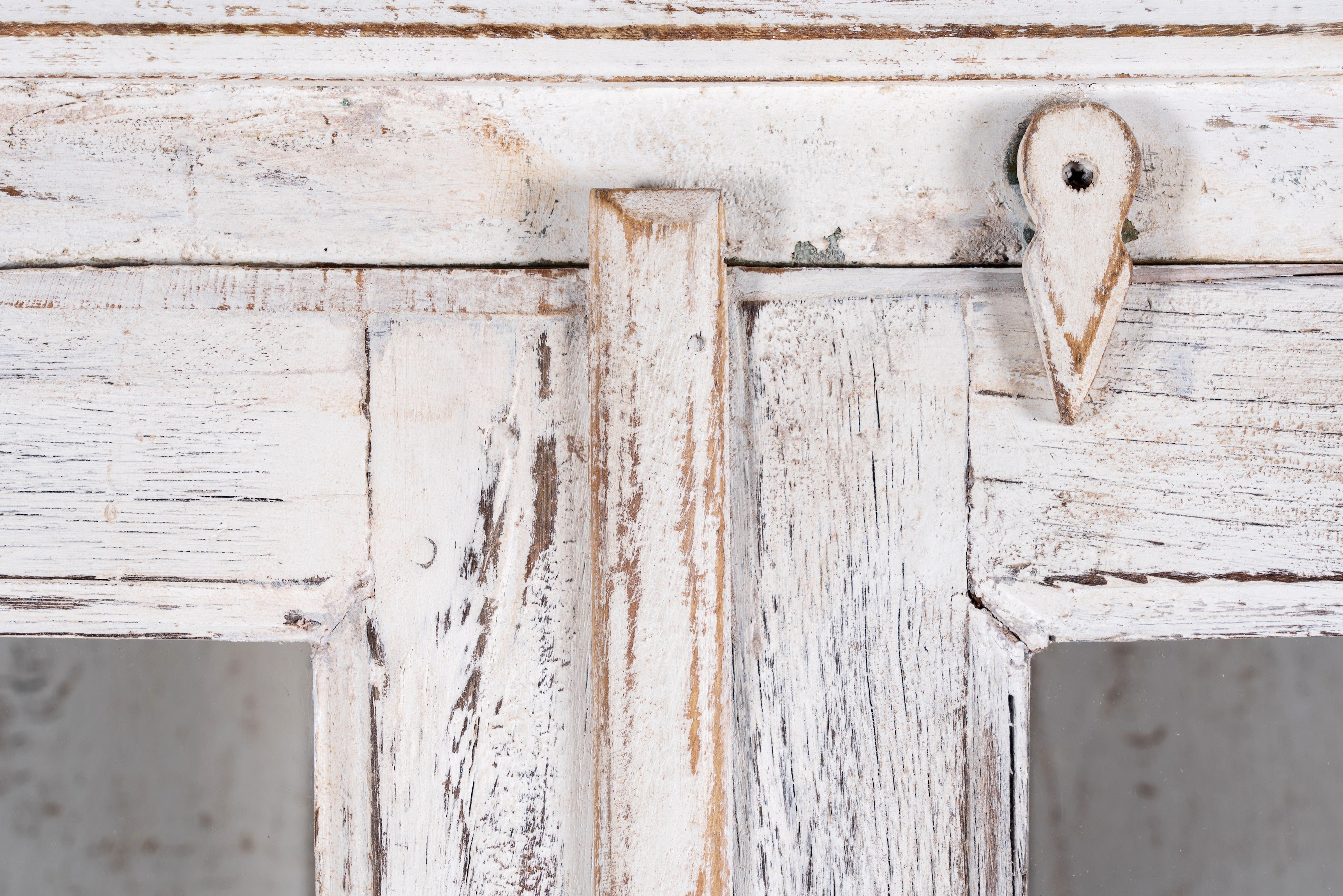 Refurbished antique teak wood display cabinet with whitewashed finish and glass doors – wooden display cabinet blending Mediterranean charm and timeless craftsmanship.