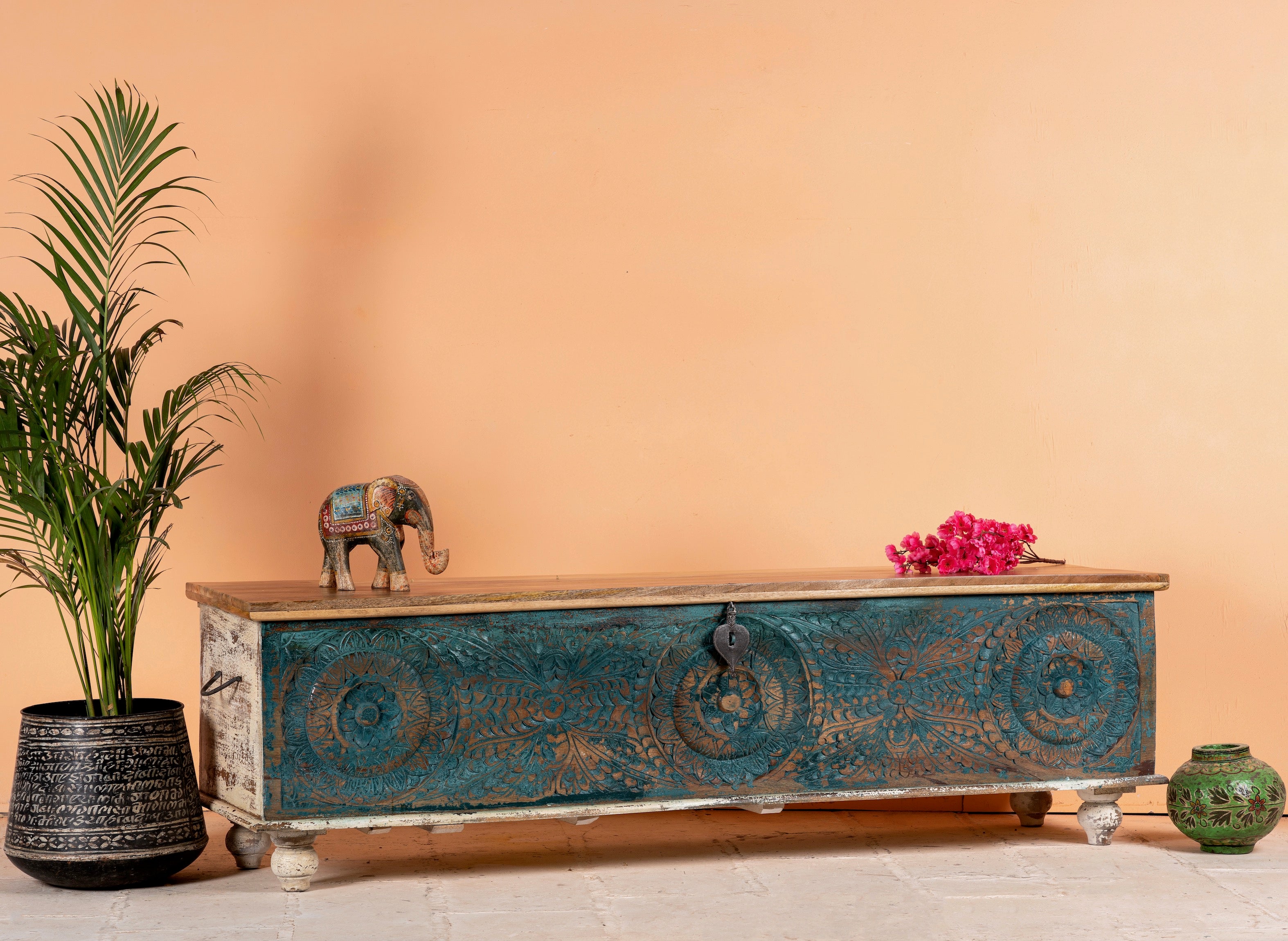 Side angle image of a mediterranean-style mango wood chest with natural finish – vintage style furniture ideal as a coffee table or TV stand with storage.