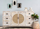 White mango wood and rattan sideboard with six drawers and two compartments—handcrafted bedroom furniture blending Indian artistry with Scandinavian design.